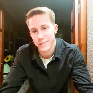 николай